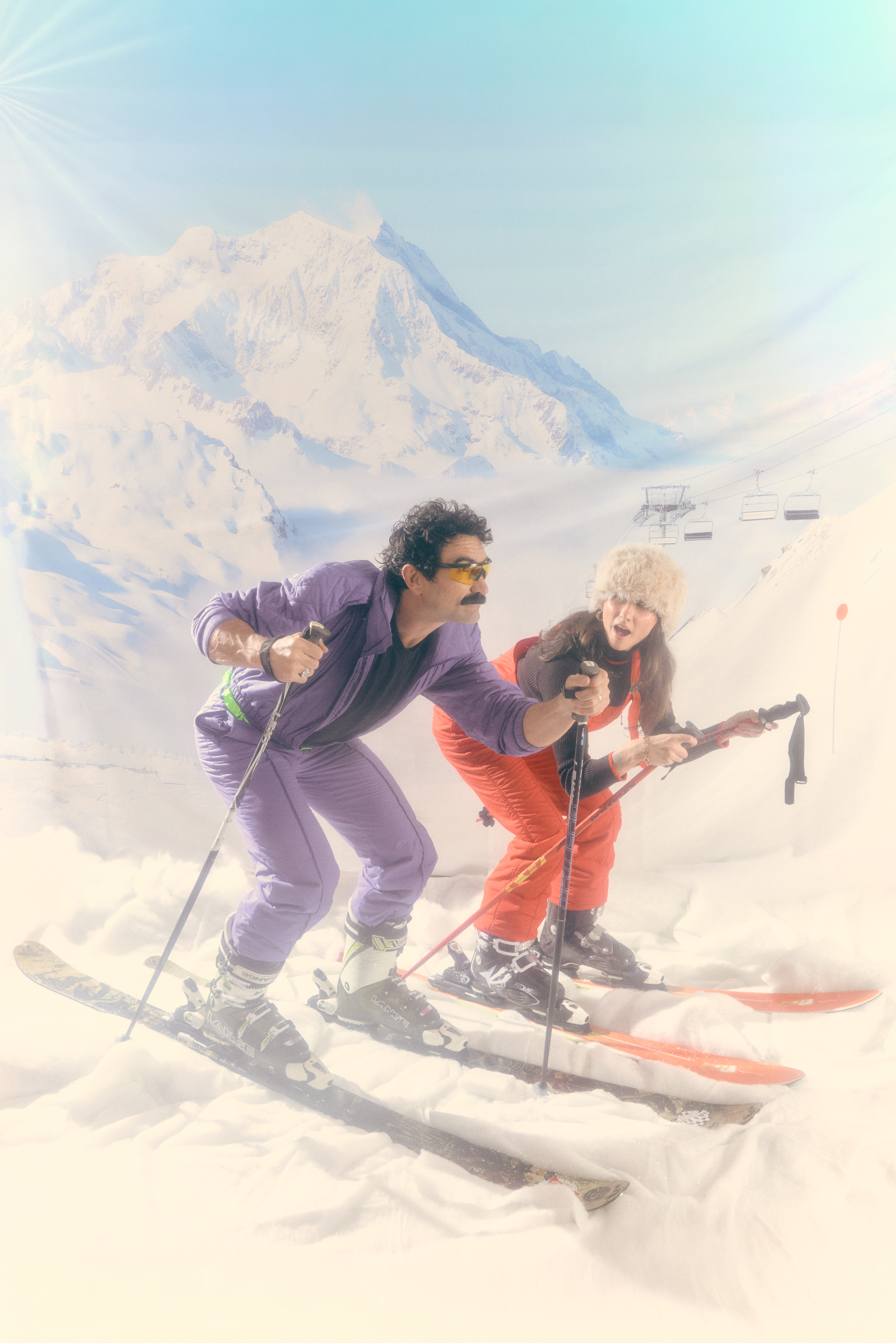 Two Limber crew members skiing down the mountain together